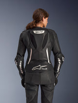 Alpinestars Stella GP-R7 2-Piece Leather Suit, Women's Motorcycle Suit, Black with white accents, back view showing the Supertech R10 aero hump with GP-R7 logo, Tech-Air Ready branding on the lower back, white Alpinestars lettering on the sleeves, and accordion stretch panels for racing performance