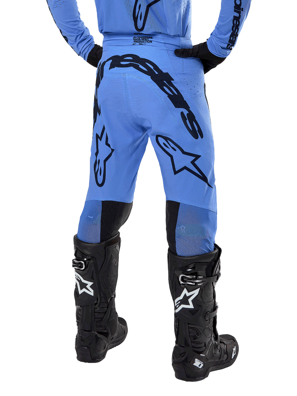 Alpinestars 2024 Supertech Dade Pants, Motocross Pants, Light Blue, rear view showing large black branding on the seat and legs, worn with black Alpinestars Tech 10 boots, athletic race fit for professional off-road performance.