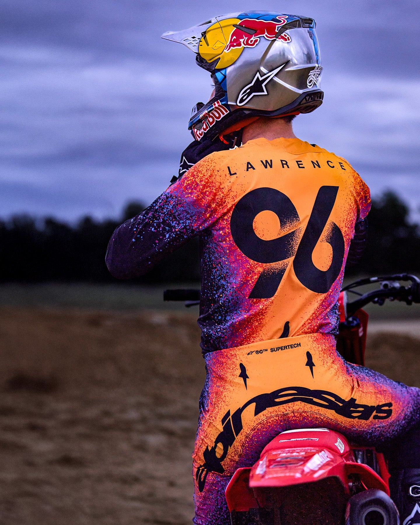 Alpinestars Limited Edition Supertech Black Hole Goggles AND M10 Helmet, black and orange professional motocross gear.