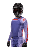 Alpinestars 2024 Techstar Ocuri Jersey, Motocross Racing Jersey, Purple and Hot Orange, long-sleeve with laser-cut perforations for ventilation, athletic race fit, worn with black motocross helmet and gloves