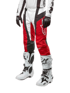 Alpinestars 2024 Techstar Ocuri Pants, Motocross Racing Pants, Mars Red White and Black, worn with matching white and black jersey, black gloves, and white racing boots with buckles, technical protective gear shown on a white background