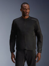 Male model wearing Alpinestars C-1 Air Jacket in Black, contemporary motorcycle jacket with extensive tech mesh panels and a full front zipper, paired with matching black riding pants, urban lifestyle and commuting aesthetic