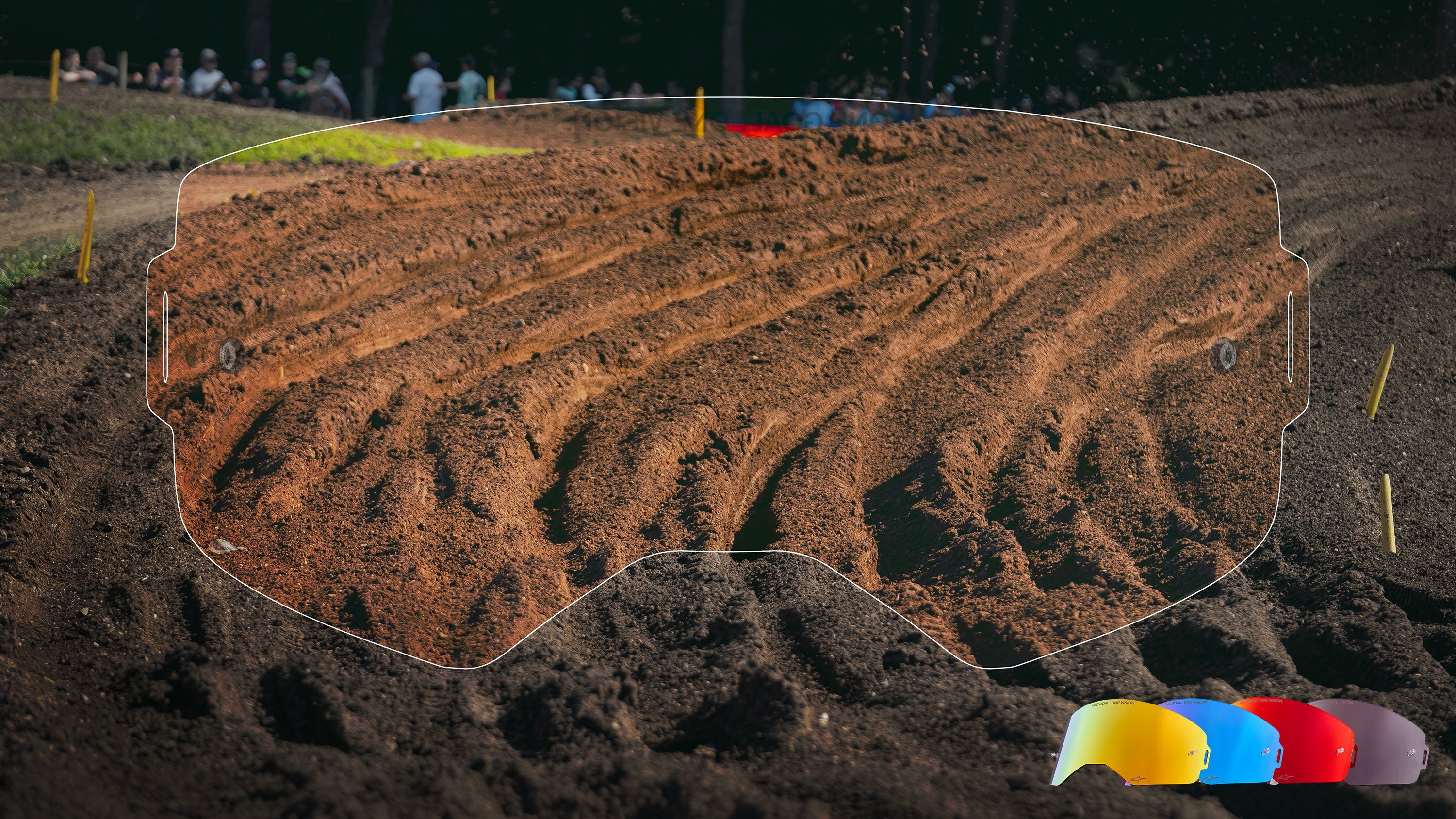 Alpinestars Motocross Goggle Lenses, high-contrast vision on a dirt track, featuring yellow, blue, and red color options.