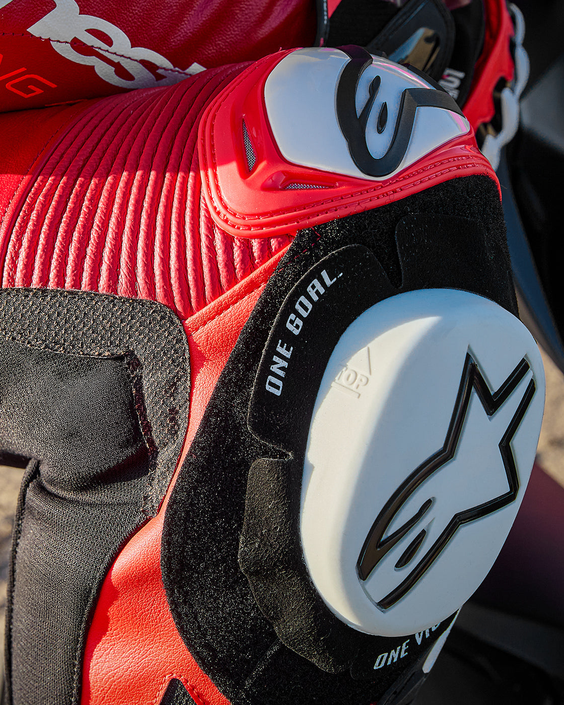 Alpinestars GP Plus V4 Sprint Leather Suit, racing motorcycle gear, red and black leather with white knee slider.
